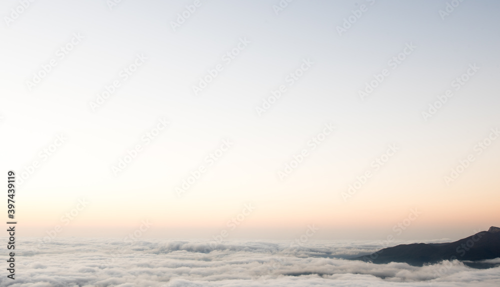 View of the clouds from the mountain. Mountain morning landscape.