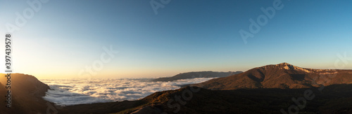 Panorama of mountains and clouds above the horizon. Mountain morning landscape. © Alexandra Mareeva