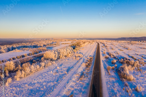 Winter landscape highway to the horizon,