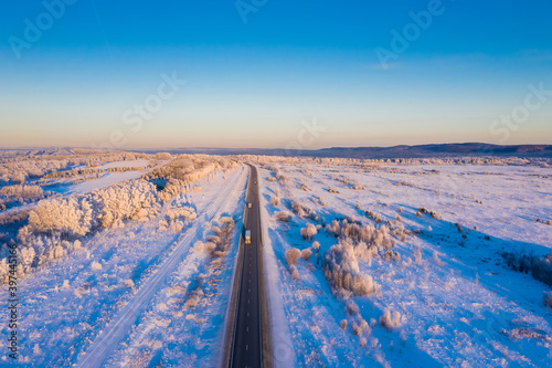 Winter landscape highway to the horizon,