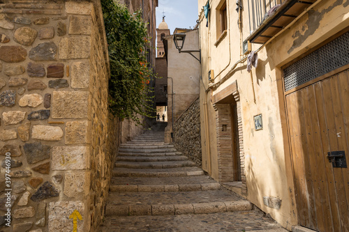 a narrow street with stairs and traditional old houses in Tarazona, province of Zaragoza, Aragon, Spain photo