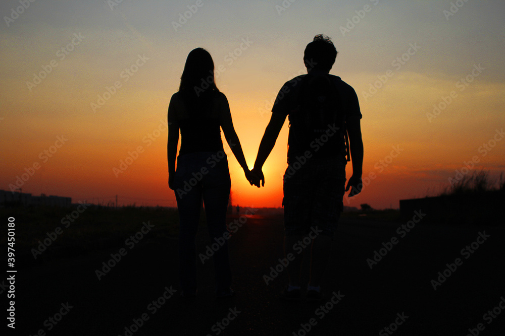 silhouette of a couple at sunset