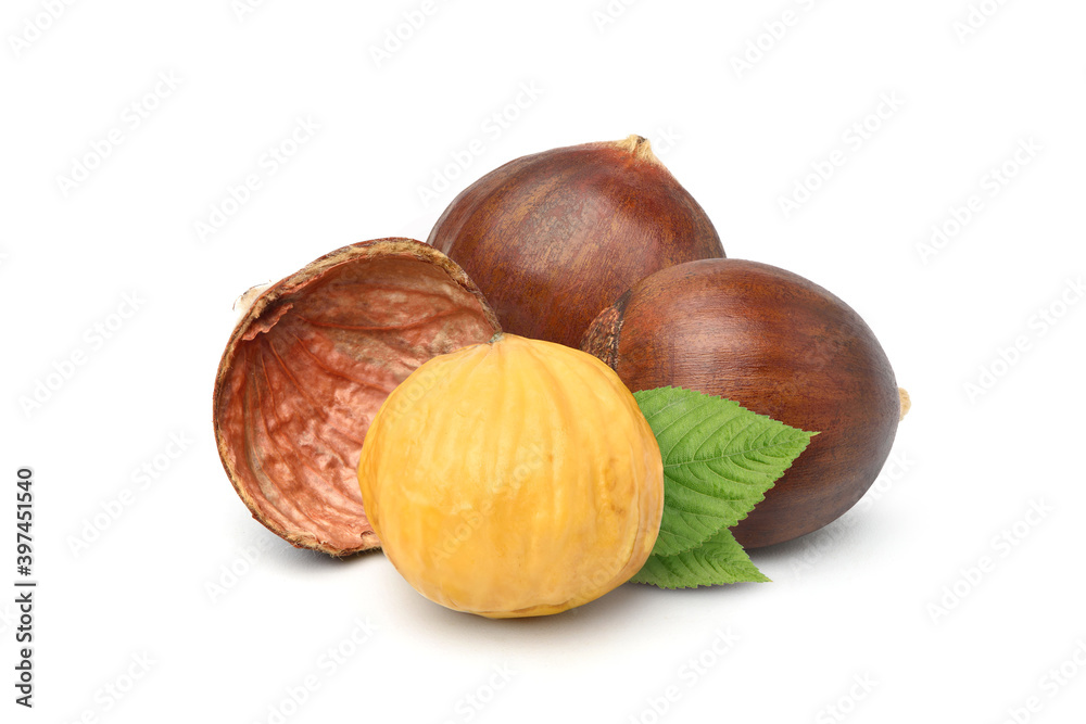 Close-up Chestnuts with peeled with green leaves isolated on white background. Close-up Chestnuts with peeled with green leaves isolated on white background.
