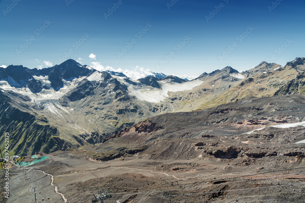 Sunny view of stone valley from mountain Elbrus, North Caucasus, Kabardino-Balkaria, Russia. Sunny view of stone valley from mountain Elbrus, North Caucasus, Kabardino-Balkaria, Russia.