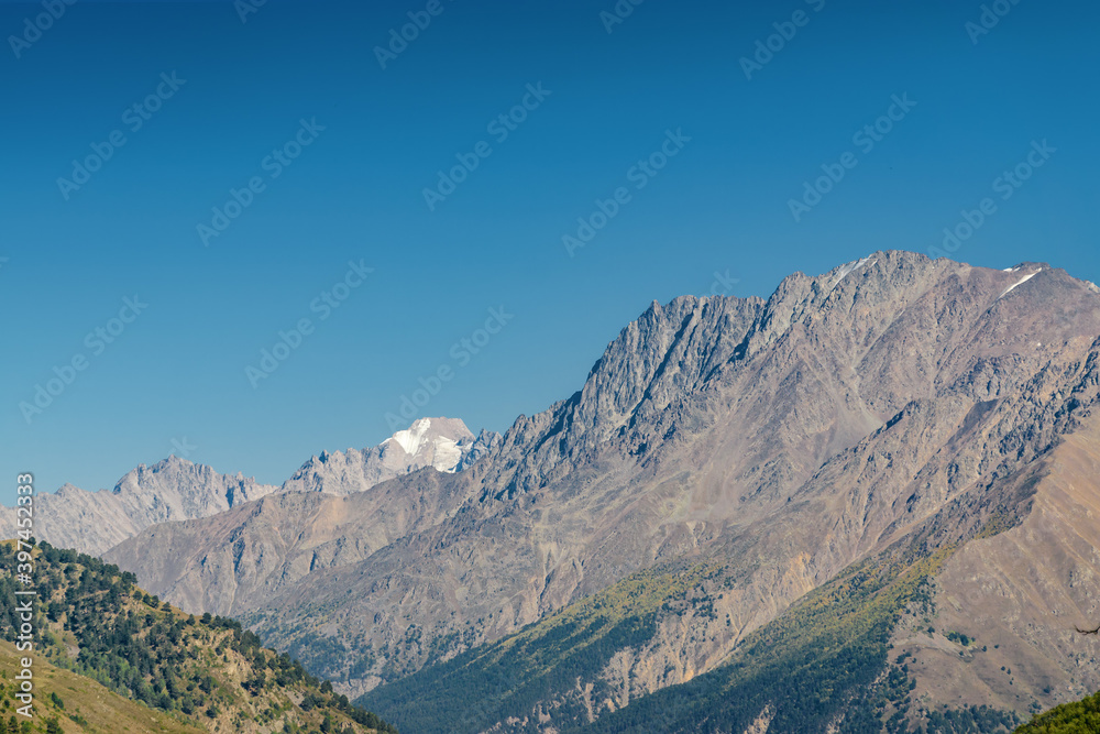 Sunny view of Cheget village near mountain Elbrus, North Caucasus, Kabardino-Balkaria, Russia. Sunny view of Cheget village near mountain Elbrus, North Caucasus, Kabardino-Balkaria, Russia.
