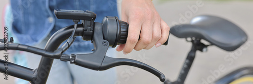 Healthy lifestyle. Woman hold handlebars of bicycle close up. Rent and hire of sports equipment.