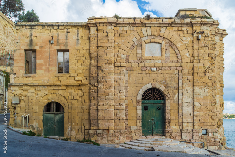 The remains of the old Quarantine building next to the Grand Harbour at Barriera Wharf, Valletta, Malta.