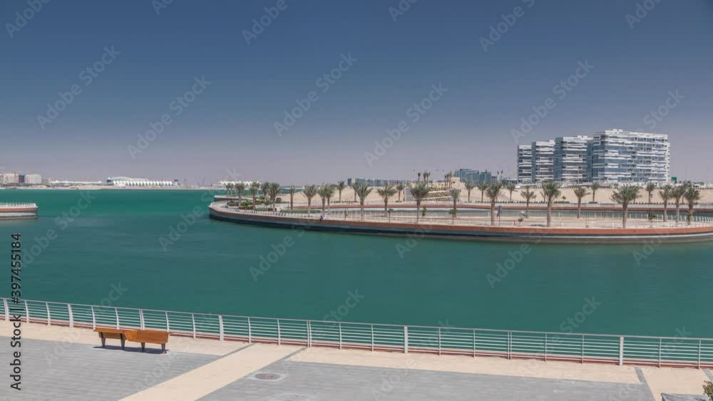 The Yas Island Beach Area and Al Dana timelapse. This is a man-made island with houses and walkway in Abu Dhabi, the capital city of the United Arab Emirates The Yas Island Beach Area and Al Dana timelapse. This is a man-made island with houses and walkway in Abu Dhabi, the capital city of the United Arab Emirates