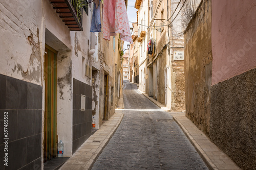 a narrow cobbled street with traditional old houses in Tarazona city, province of Zaragoza, Aragon, Spain
