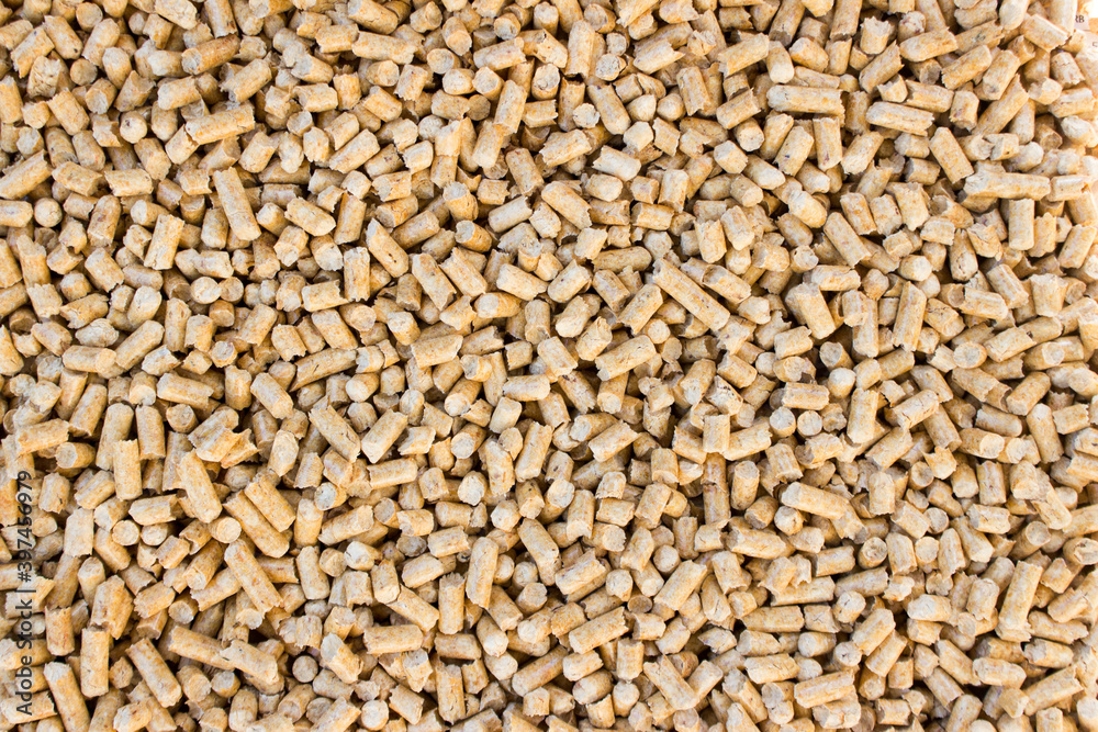 Wooden pellets background, pattern. Close up natural wood pellet. Ecological heating, renewable energy. Flat lay ecological fuel for heaters. Wooden pellets background, pattern. Close up natural wood pellet. Ecological heating, renewable energy. Flat lay ecological fuel for heaters.