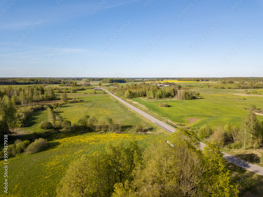 summer fields forests and roads in countryside view from above drone image