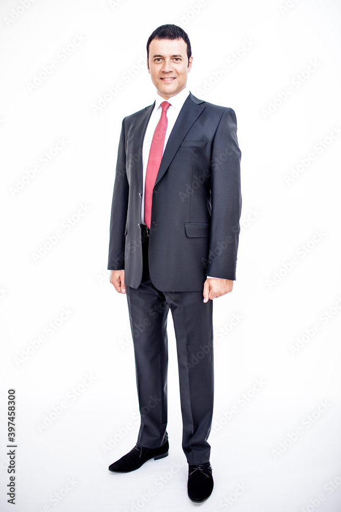 A man in a classic suit. Studio photo on a white background. Snapshot as for a catalog. A man in a classic suit. Studio photo on a white background. Snapshot as for a catalog.