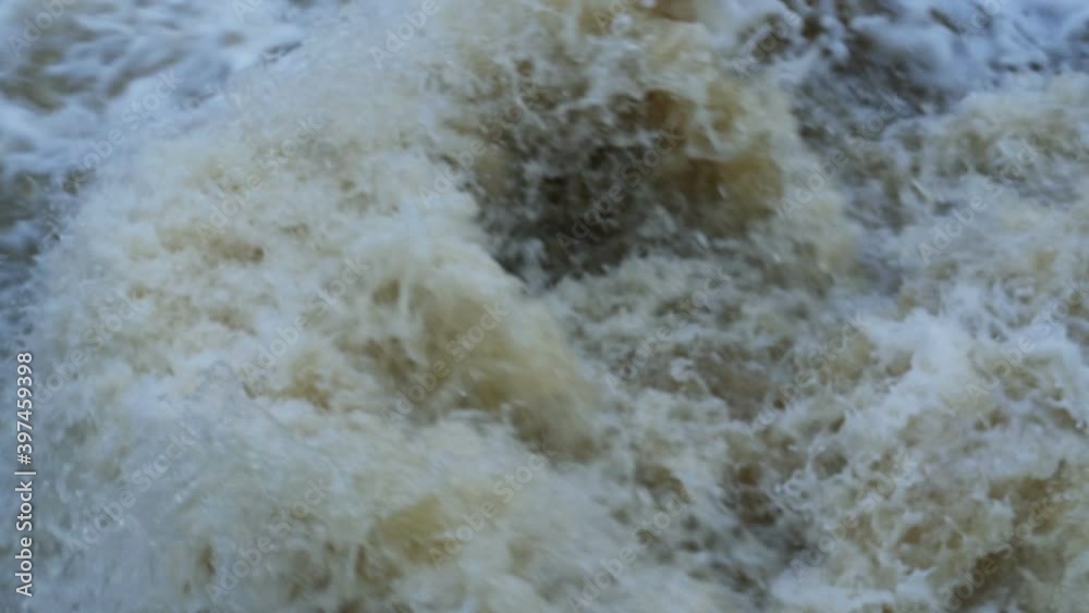seething stream white water crashes on rocks, slow motion seething stream white water crashes on rocks, slow motion