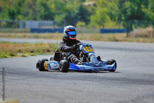 Young go cart racer on circuit