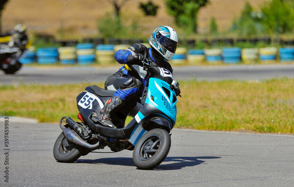 Motorcycle practice leaning into a fast corner on track