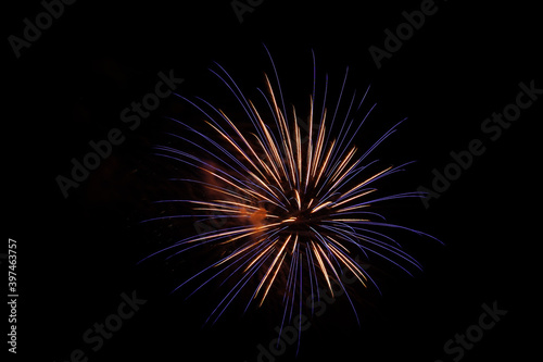 Single purple colored firework burst, right side of image, isolated on black, bright colorful, copy space.