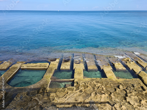 Fond Ghadir Beach, Sliema, Malta - The man made rock pools which are commonly referred to as Roman Baths but date back to the Victorian era.