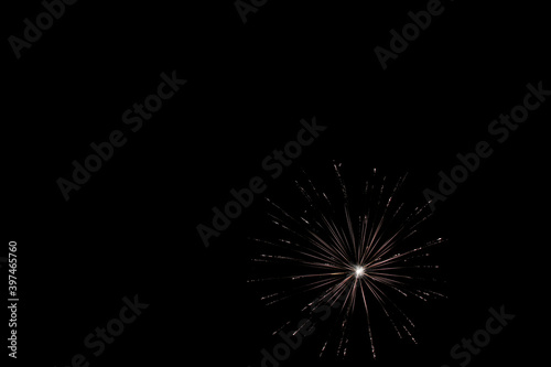 Single white firework isolated on black, bright colorful, copy space.