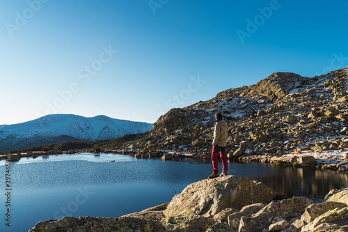 young boy looking at the landscape on the mountain