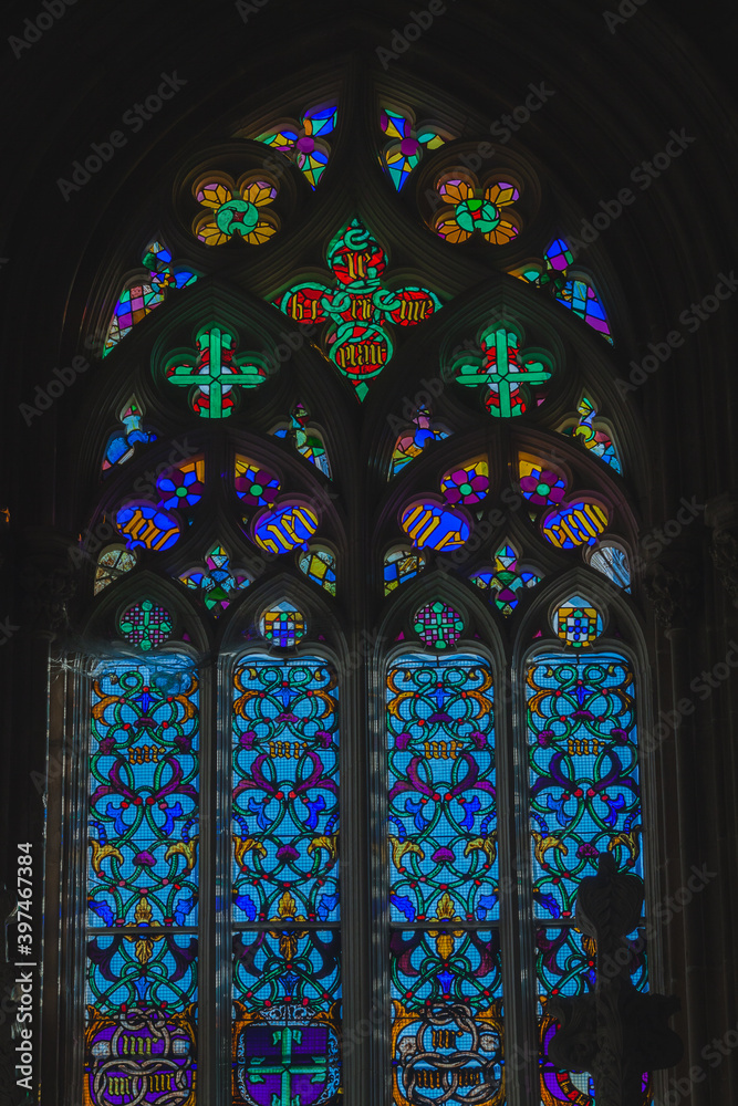 stained glass windows in the limit with tombs of kings in an ancient portuguese monastery
