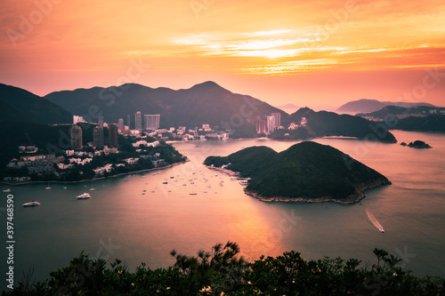 Overlooking view of Middle islands, buildings in seaside at Deep Water Bay, Hong Kong seen form brick hill (nam long shan) in sunrise time