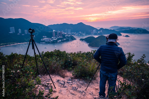 Overlooking view of Middle islands, buildings in seaside at Deep Water Bay, Hong Kong seen form brick hill (nam long shan) in sunrise time photo