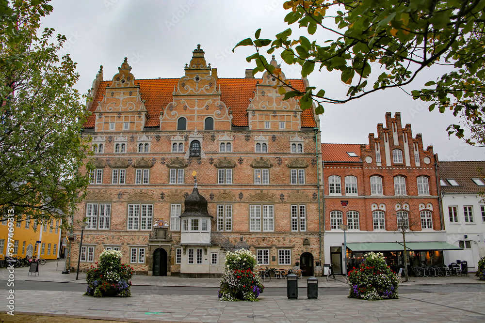 Naklejka premium Aalborg street scene with a beautiful Dutch renaissance style 5 story landmark building. It was constructed in 1624 for merchant Jens Bang, Aalborg, Jutland region of Denmark, Scandinavia.