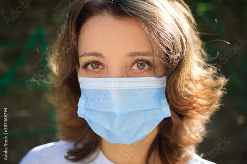 Coronavirus Covid-19 outbreak. Young woman wearing surgical mask on the face for protection from virus during pandemia, quarantine concept