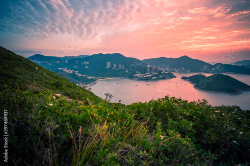 Overlooking view of Middle islands, buildings in seaside at Deep Water Bay, Hong Kong seen form brick hill (nam long shan) in sunrise time