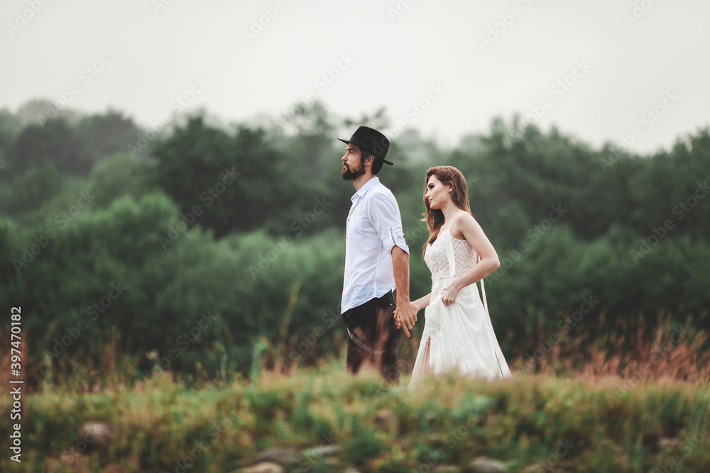 Fototapeta premium Beautiful young couple. Wedding photo session outdoors in the mountains. Happy couple. New family.
