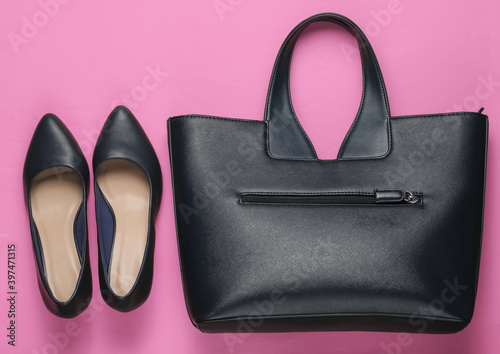 Classic high heel shoes, leather bag on pink background. Minimalism fashion concept. Top view