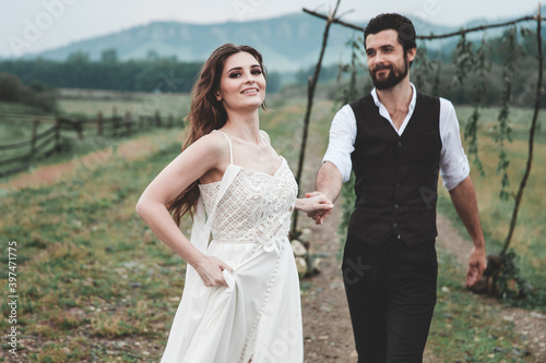 Beautiful young couple. Wedding photo session outdoors in the mountains. Happy couple. New family.