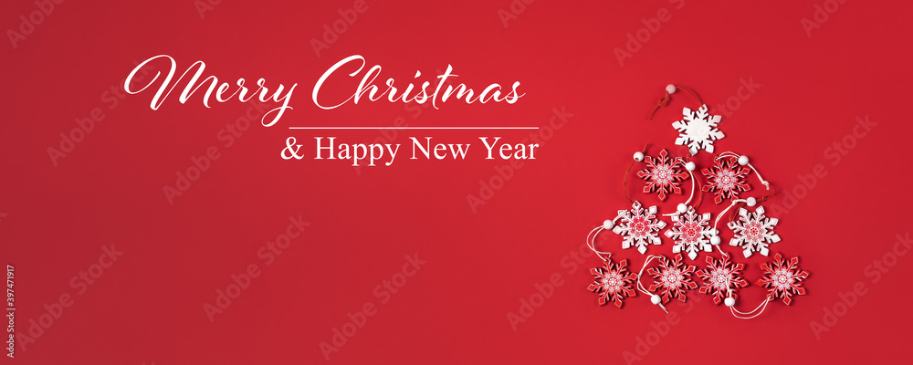Text Merry Christmas and Happy New Year and snowflakes in form of tree on red background