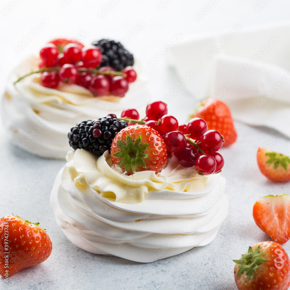 Delicious Pavlova cake with whipped cream and fresh berries. Close-up. Selective focus - Image