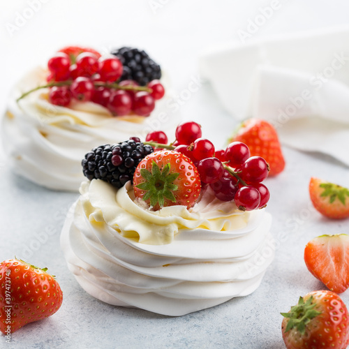 Obraz na płótnie Delicious Pavlova cake with whipped cream and fresh berries. Close-up. Selective focus - Image w salonie
