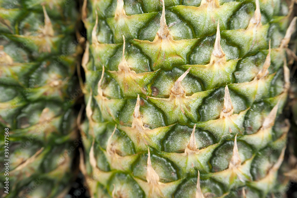 close to a whole pineapple . pineapple texture on the outside close to a whole pineapple . pineapple texture on the outside