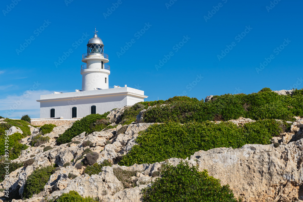 Building of Faro de Cavalleria in Minorca, with a blue sky in horizontal, with no people
