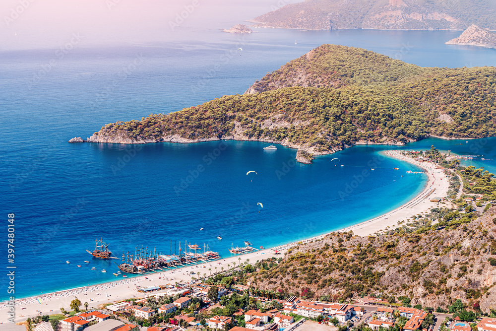 famous and popular Turkish resort town of Oludeniz, aerial view of a fantastic sand bar and a bay with turquoise water. Vacation and beach holiday concept
