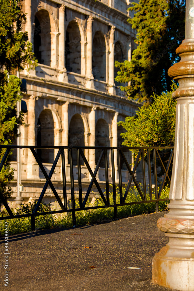 Fototapeta premium landscape with colosseum, street lamp and road