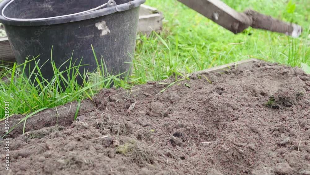 Plowing land in dry grass beds for winter preparation Plowing land in dry grass beds for winter preparation