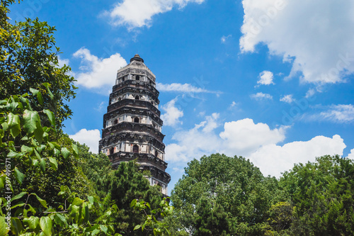 Tiger Hill Pagoda (Pagoda of Yunyan Temple) over trees on Tiger Hill (Huqiu) in Suzhou, Jiangsu, China