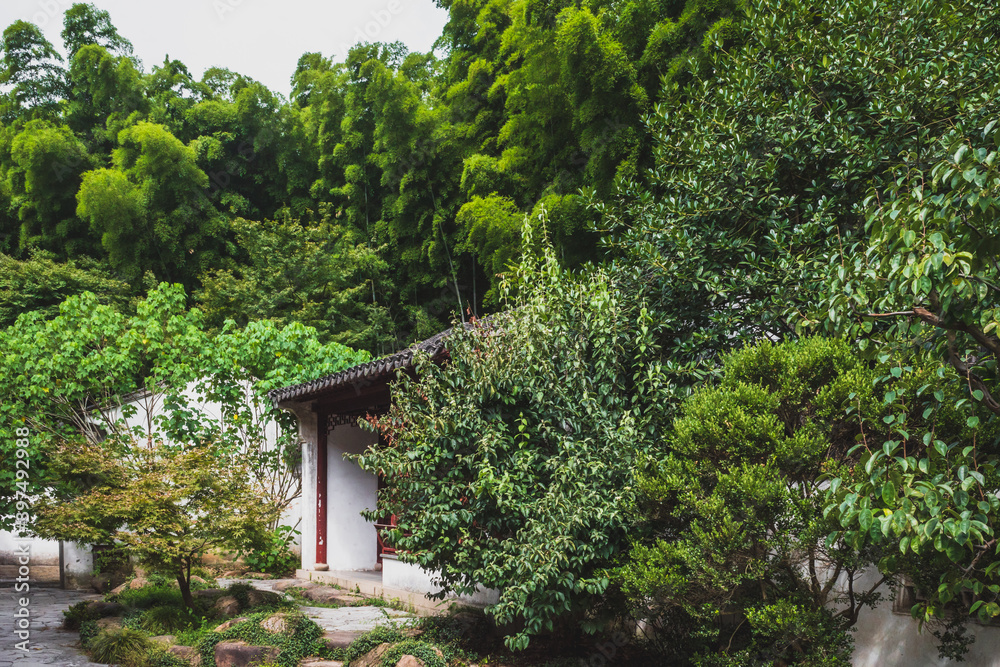 Traditional Chinese architecture among trees on Tiger Hill (Huqiu), Suzhou, Jiangsu, China Traditional Chinese architecture among trees on Tiger Hill (Huqiu), Suzhou, Jiangsu, China