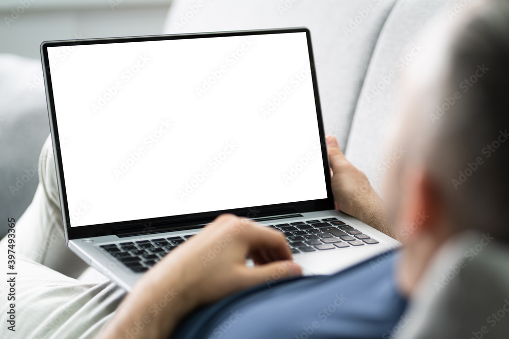 Guy Sitting On Sofa Using Laptop Guy Sitting On Sofa Using Laptop