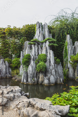 Giant rock in pond at Lingering Garden Scenic Area, Suzhou, Jiangsu, China