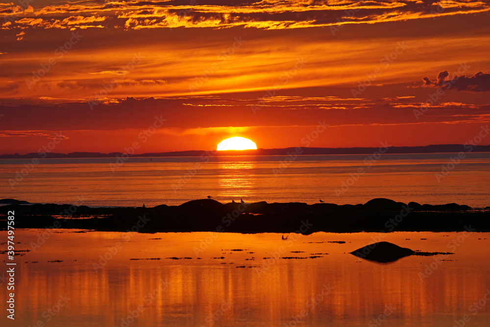 Awesome orange tones  sunset on the Saint-Lawrence river in Cap-Chat Gaspesie