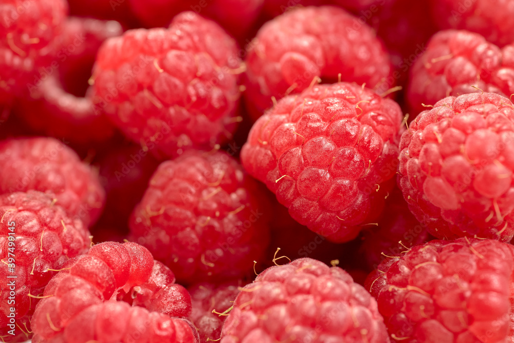 Closeup shot of sweet and ripe raspberries on a blurred background Closeup shot of sweet and ripe raspberries on a blurred background