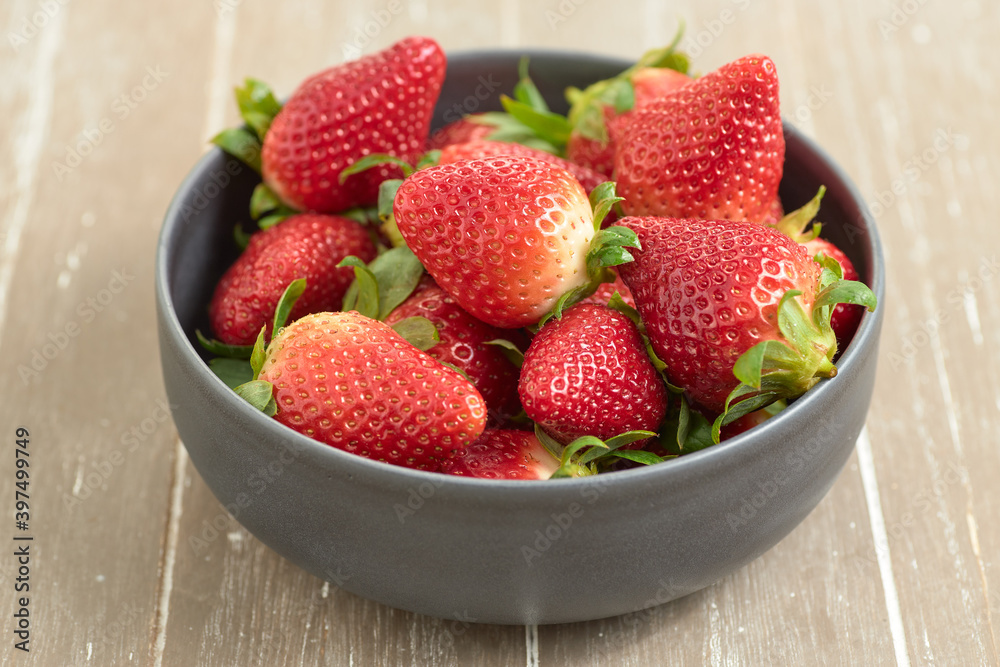 Closeup shot of sweet and ripe strawberries on a blurred background Closeup shot of sweet and ripe strawberries on a blurred background