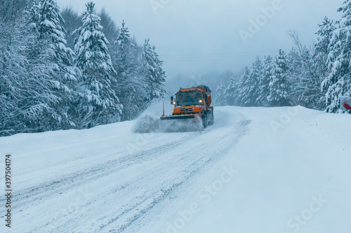 It's winter time. The mountain road is snowy and slippery. The snow plow clears the way. Uludag National Park. Bursa, Turkey. 