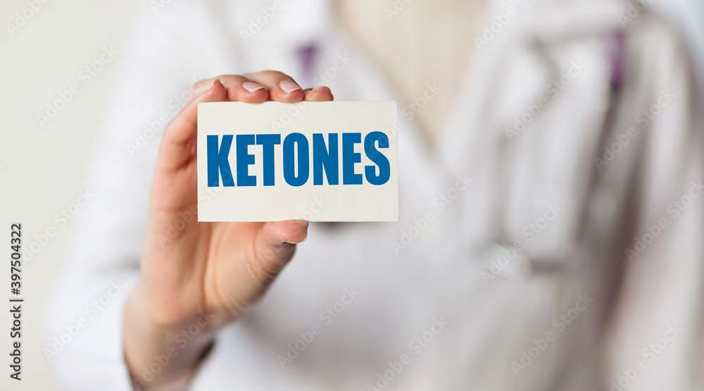 Doctor holding a card with text word KETONE, medical concept. Doctor holding a card with text word KETONE, medical concept.