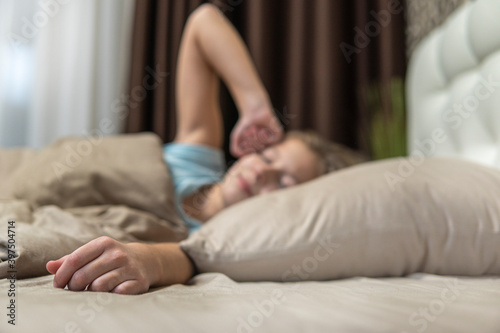 girl with dark hair woke up in bed in the morning
